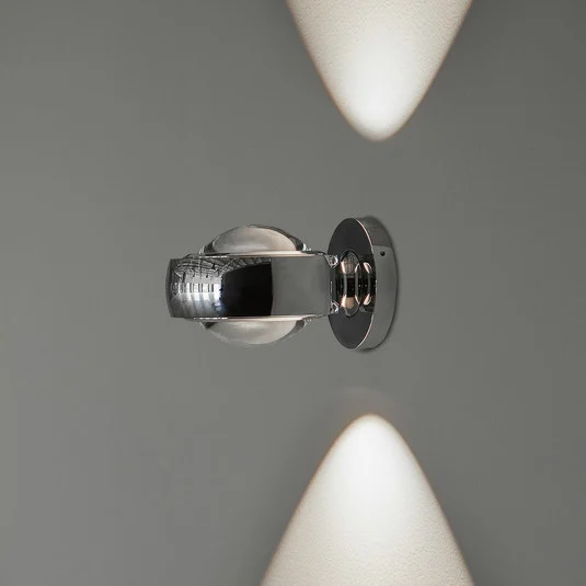 Aplique de pared LED LOOM DESIGN Optic, aluminio cromado, Ø 12 cm